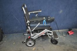 A FREEDOM CHAIR ELECTRIC WHEELCHAIR, with power supply (PAT pass and working) Condition Report: no