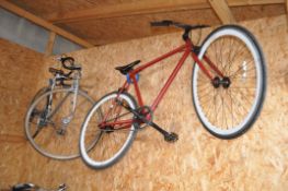 A PUCH GENTS RACING BIKE, with a 21in frame and ten speed Simplex gears, along with another bike (