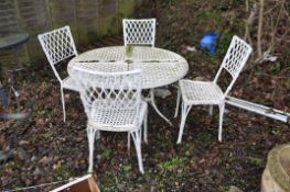 A BAMBOO EFFECT CAST ALUMINIUM GARDEN TABLE AND FOUR CHAIRS with pierced latticework top, diameter