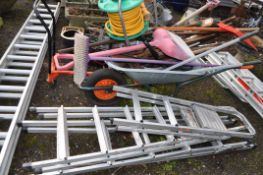 A BUILDERS WHEELBARROW GARDEN TOOLS AND STEP LADDERS (20+)