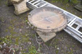 A MODERN CONCRETE BIRD BATH IN THE FORM OF A BALUSTERED URN with fluted bowl and tapering fluted