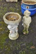 A MODERN CONCRETE BIRD BATH, with three small children holding the bowl aloft, along with a mid