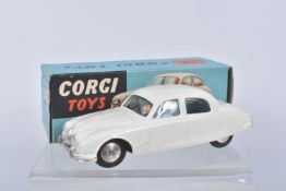 A BOXED CORGI TOYS JAGUAR 2.4 LITRE CAR, numbered 208, added tax disk to window, metal wheels and
