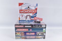FIVE BOXED HASBRO UK MONOPOLY SETS, to include a sealed 2009 Team GB Special Edition, a sealed