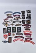 A BOX CONTAINING OVER FORTY UNIT AND FORMATION PATCHES, SAS, SBS, COMMANDO, AND OTHER ARMY UNITS AND