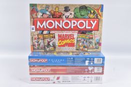 FOUR SEALED BOXED MONOPOLY SETS, to include a 2020 Roald Dahl set, plastic wrapping with some tears,
