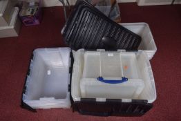 A QUANTITY OF EMPTY PLASTIC BOXES, assorted sizes, all with lids included or attached, 17 in total