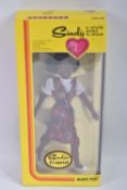A BOXED MARX TOYS SINDY GAYLE DOLL, numbered 1000, featuring a posed lady in floral dress and