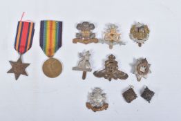 A WWI VICTORY MEDAL AND A WWII BURMA STAR AND SEVEN CAP BADGES, the victory medal is named to