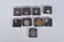 A SELECTION OF MILITARY RELATED CHALLENGE COINS AND PIN BADGES, mainly U.S.A. and Canada, to include