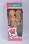 A BOXED PEDIGREE SINDY STARLIGHT DOLL, numbered 42011, shiny pink outfit dolls shoes free within the