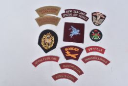 A VARIED AND RARELY SEEN NUMBER OF UNIT PATCHES AND SHOULDER TITLES , to include Royal Marines