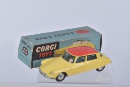 A BOXED CORGI TOYS CITROEN D.S. 19 CAR, numbered 210, lemon body, red roof, grey base, added tax