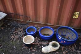 A SET OF THREE GRADUATING GLAZED PLANTERS, diameter 44cm x height 27cm, another glazed plant pot,