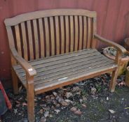 A STAINED TEAK GARDEN BENCH, with plaque reading MESCH to the back, length 119cm, condition
