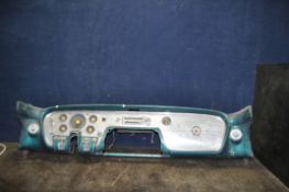 A 1950'S PACKARD CLIPPER SUPER DASHBOARD, with distressed metallic green paintwork, polished