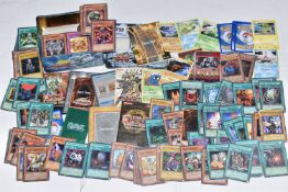 A TIN OF OVER THREE HUNDRED YU-GI-OH CARDS, includes first editions, rares, ultra rares and secret