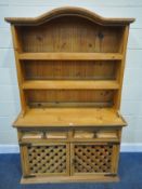 A MODERN PINE DRESSER, the arched two tier plate rack, atop a base with two drawers, over double