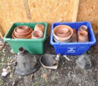 TWO TRAYS CONTAINING TERRACOTTA AND OTHER PLANT POTS, along three vintage cast iron items