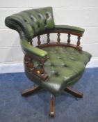 A 20TH CENTURY SWIVEL OFFICE CHAIR, with green buttoned leather upholstery, width 64cm x depth