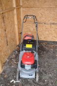 A HONDA HRB425c SELF PROPELLED PETROL LAWN MOWER, with collection bag and a petrol can (starts and