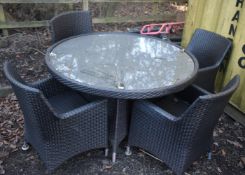 AN UNBRANDED FAUX RATTAN CIRCULAR GARDEN TABLE, diameter 131cm x height 76cm, along with four chairs