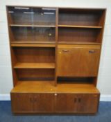 G PLAN, A MID CENTURY TEAK WALL CABINET, fitted with double glass sliding doors, a fall front