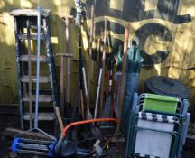 A SELECTION OF GARDEN TOOLS, the hand tools include shovels, rakes, brush, etc, a watering can,