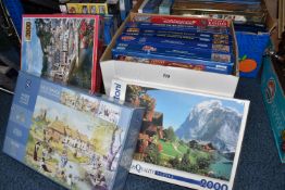 THREE BOXES OF JIGSAW PUZZLES, over twenty five puzzles of which eight are still sealed, makes