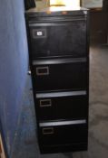 A MODERN BLACK FILING CABINET, with four drawers, single drawer opening safety feature and two keys.