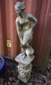 A WEATHERED COMPOSITE GARDEN STATUE, of a scantily salad lady, on an odd separate plinth, height