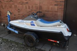 A YAMAHA WAVERUNNER WR500 JET SKI, with a jet ski trailer, manual, box of accessories and covers,