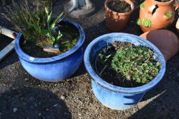 TWO BLUE GLAZED PLANTERS, one with loose feet, largest diameter, 52cm x height 32cm