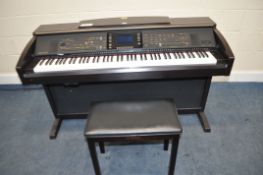 A YAMAHA CLAVINOVA CVP-305 ELECTRONIC PIANO, in a walnut effect cabinet total length 143cm, with a