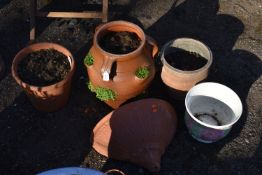 A GLAZED TERRACOTTA STRAWBERRY POT, three terracotta plant pots, and ceramic pot, condition