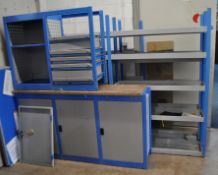 A QUANTITY OF WORKSHOP SHELVING AND CUPBOARDS including a triple door base unit with wooden top