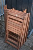 A STAINED TEAK SQUARE FOLDING GARDEN TABLE AND FOUR CHAIRS, condition report: missing bolts to table