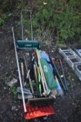 A SELECTION OF GARDEN HAND TOOLS, including shades, shovels, brushes, garden seeder, etc, three