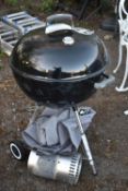 A WEBER ORIGINAL KETTLE CHARCOAL GRILL MASTER BARBEQUE, with a esscherts garden and weber tools,