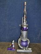 A DYSON DC25 UPRIGHT VACUUM CLEANER with upholstery head (PAT pass and working)