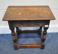 AN EARLY 20TH CENTURY OAK JOINT STOOL, with repeating geometric patterns, raised on block and turned