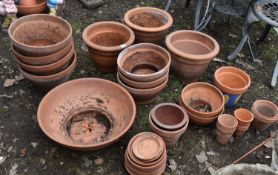 A SELECTION OF TERRACOTTA PLANT POTS / BOWLS AND SAUCERS, of various styles, shapes and sizes,