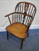 A 19TH CENTURY ELM STICK BACK ARMCHAIR, with a central splat to the backrest, dished seat, raised on