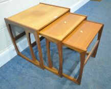 G PLAN QUADRILLE, A MID-CENTURY TEAK NEST OF THREE TABLES, largest table width 54cm x depth 44cm x