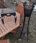 A CAST IRON TRIVET, along with a wrought iron strap work plant stand with a glazed planter, height