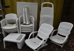 A SELECTION OF WHITE PLASTIC GARDEN FURNITURE, to include a rectangular table, two sets of four