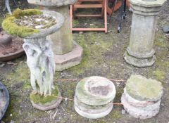 A WEATHERED COMPOSITE BIRD BATH, on a base with the scantily clad ladies, diameter 42cm x height