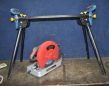 A CLARKE METALWORKER CC014 CHOP SAW with spare discs and a Workzone folding saw stand with roller