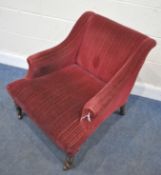 A 19TH CENTURY ARMCHAIR, with burgundy fabric upholstery, raised on turned front legs, with castors,