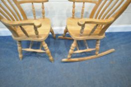 A BEECH FRAME ROCKING CHAIR, with swept armrests, raised on turned supports, width 68cm x depth 84cm